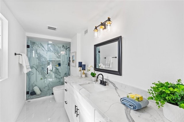 bathroom with vanity, toilet, and an enclosed shower