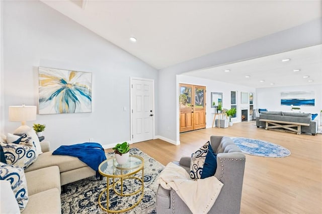 living room with hardwood / wood-style flooring and lofted ceiling