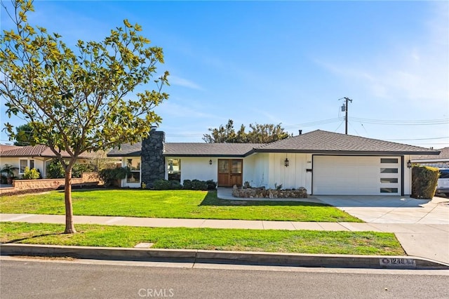 single story home with a garage and a front lawn