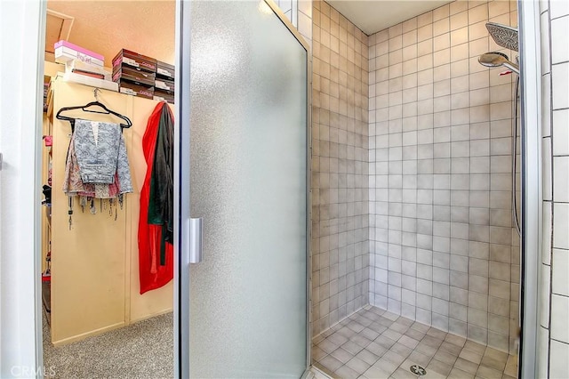 bathroom with a shower with shower door