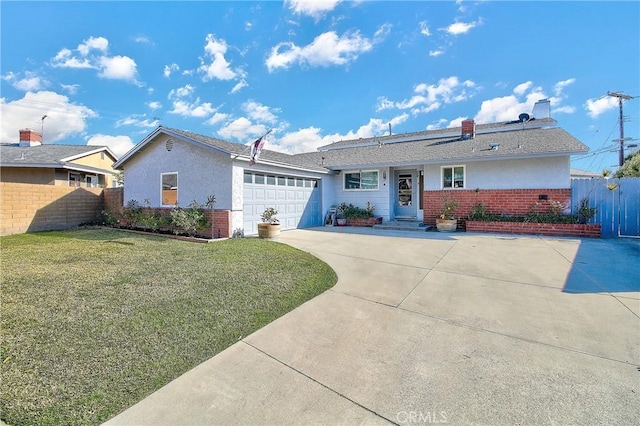 ranch-style home featuring a garage and a front yard