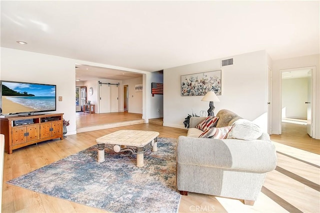 living room with light hardwood / wood-style flooring