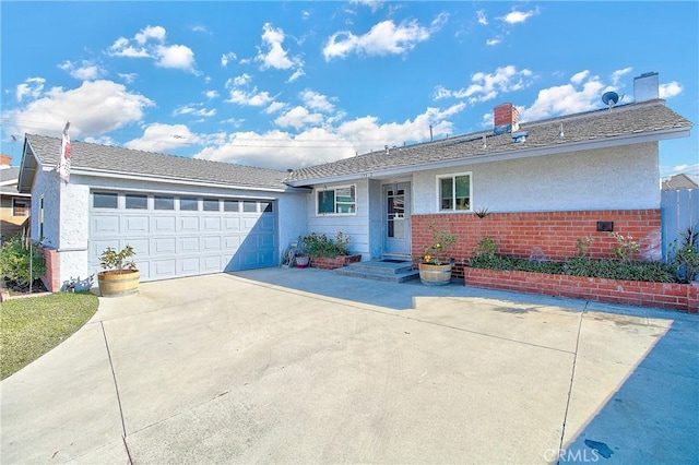 ranch-style home featuring a garage