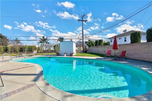 view of swimming pool with a patio