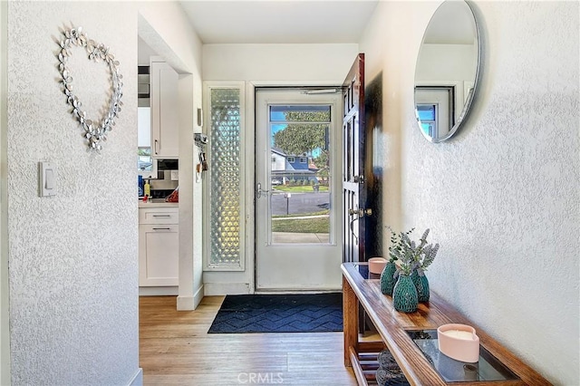 doorway featuring light wood-type flooring