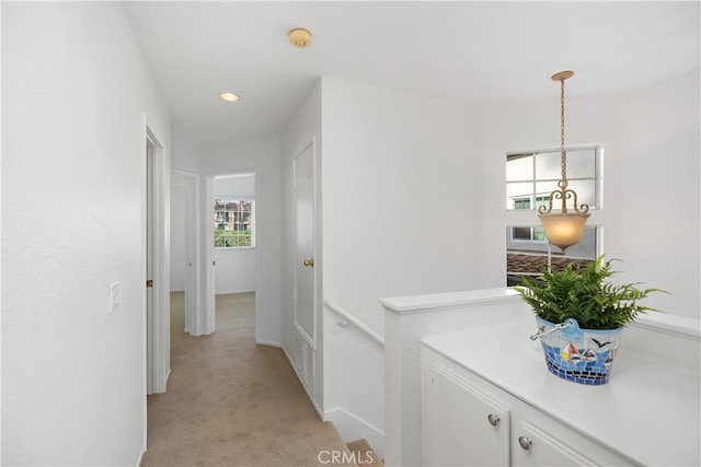 hallway with recessed lighting and light carpet