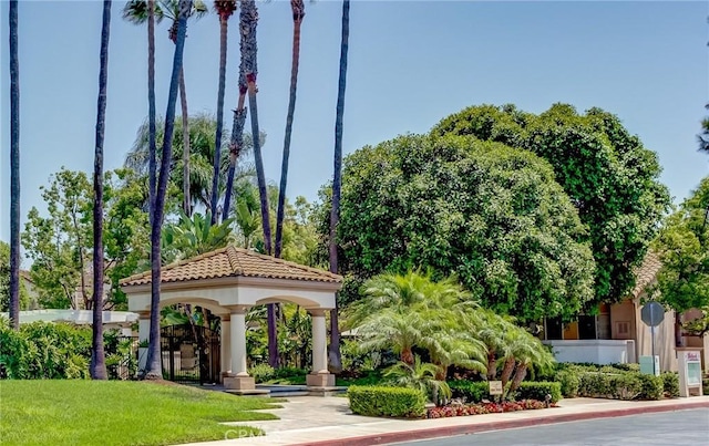 view of home's community with a gazebo and a yard