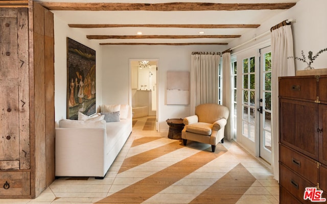 living area featuring french doors, light hardwood / wood-style flooring, and beam ceiling