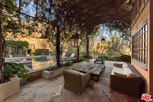 view of patio with a fenced in pool and outdoor lounge area