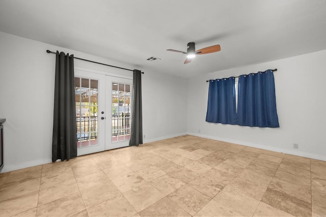 unfurnished room featuring ceiling fan and french doors