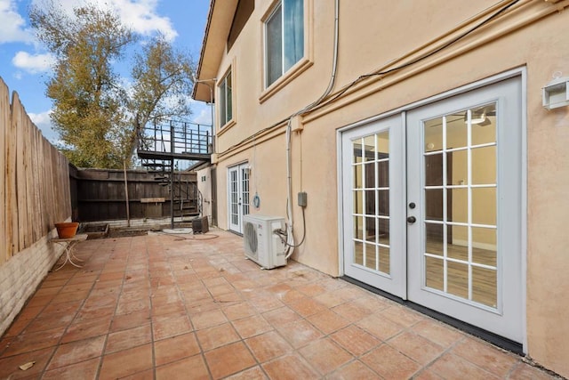 view of patio / terrace with ac unit and french doors