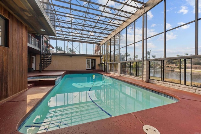 view of swimming pool with a water view