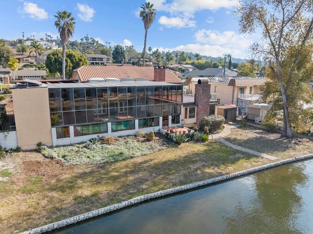 exterior space with a water view