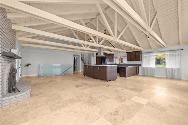 unfurnished living room with wood ceiling and beamed ceiling