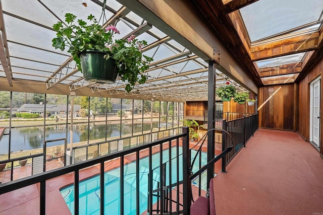 view of swimming pool with a water view