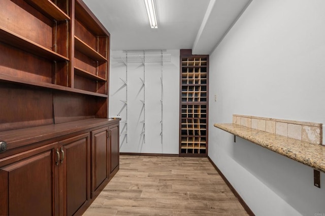 wine room with light hardwood / wood-style floors