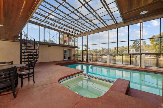 view of pool featuring a lanai, an indoor in ground hot tub, and a patio