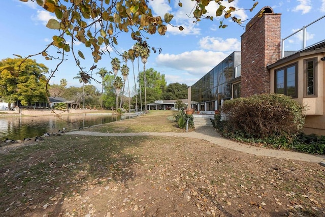 view of yard with a water view