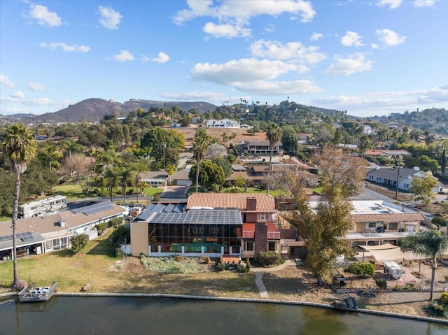 drone / aerial view with a water and mountain view