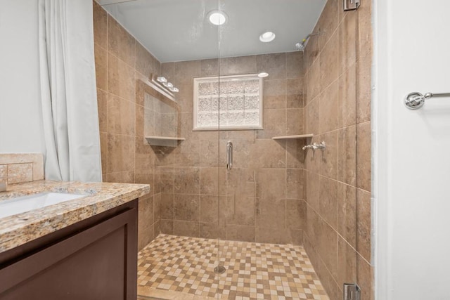 bathroom featuring vanity and a shower with shower curtain