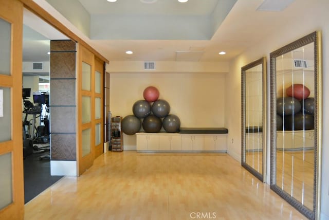 workout room featuring hardwood / wood-style flooring