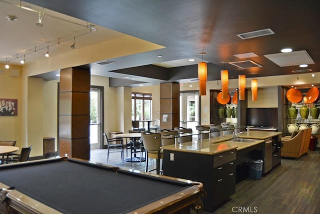 rec room with dark hardwood / wood-style floors, billiards, and track lighting