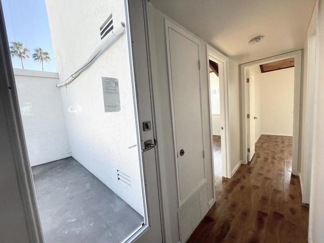 hall with dark hardwood / wood-style flooring