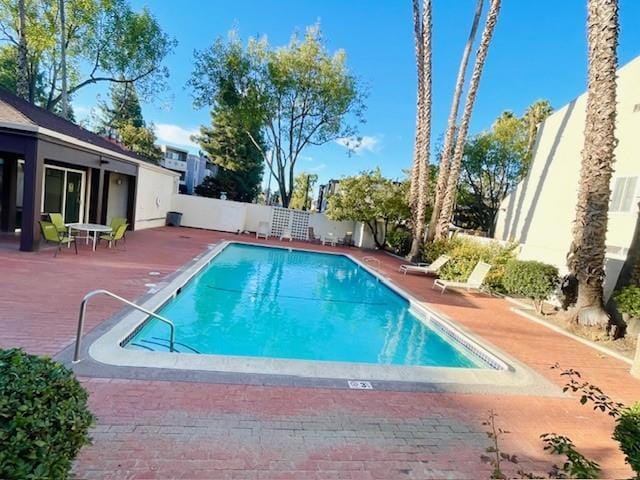 view of swimming pool featuring a patio area