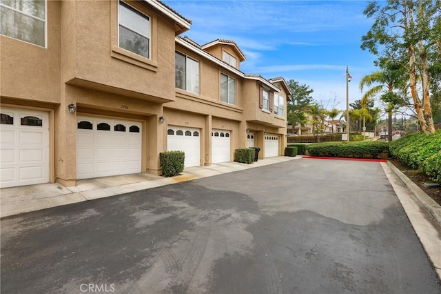 view of side of property with a garage