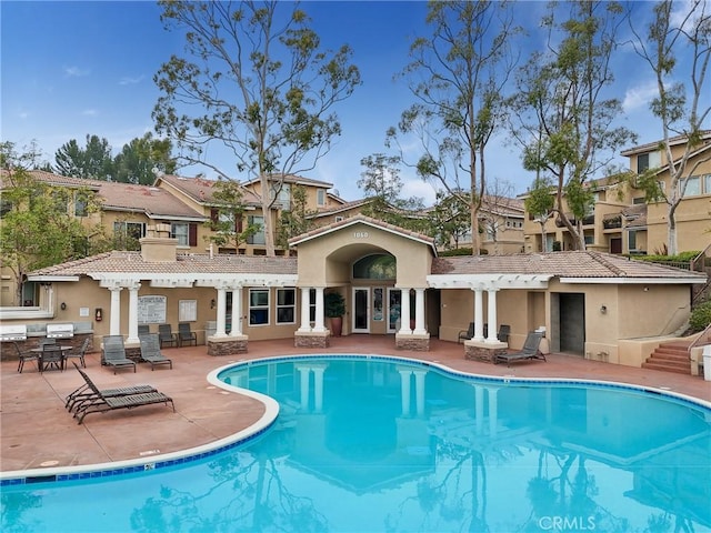 view of swimming pool with a patio