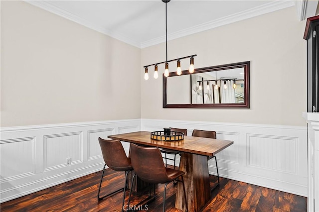 dining space featuring dark hardwood / wood-style flooring and crown molding