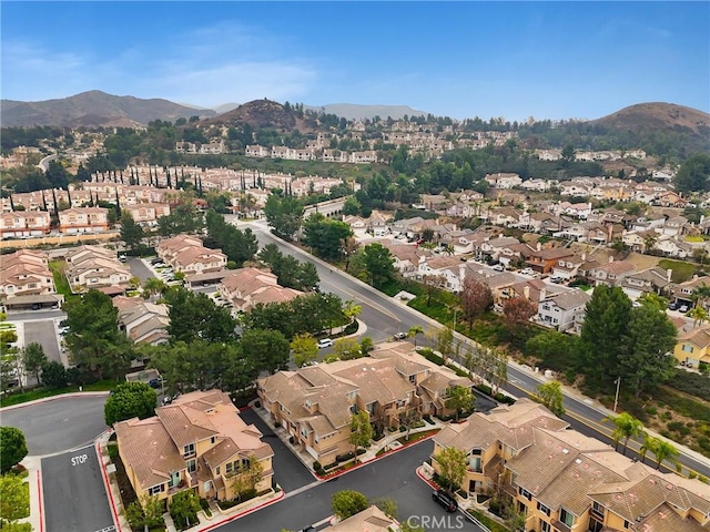 birds eye view of property with a mountain view