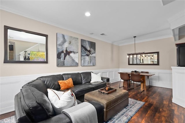 living room with dark hardwood / wood-style floors and ornamental molding