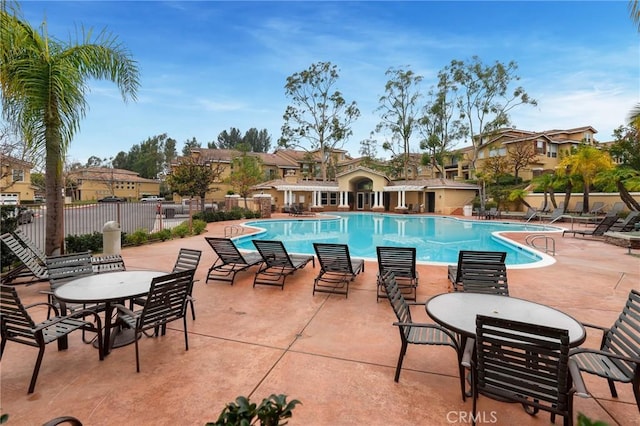 view of swimming pool featuring a patio area