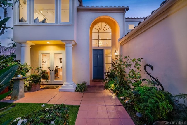 entrance to property featuring french doors