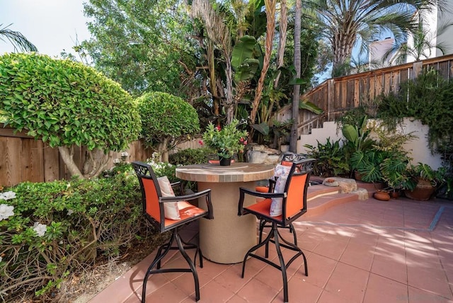 view of patio / terrace featuring an outdoor bar