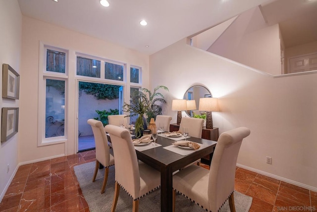 dining room with a high ceiling