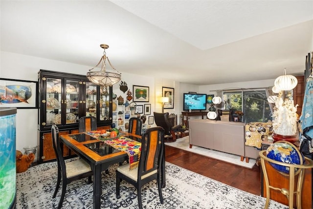 dining area with dark hardwood / wood-style flooring