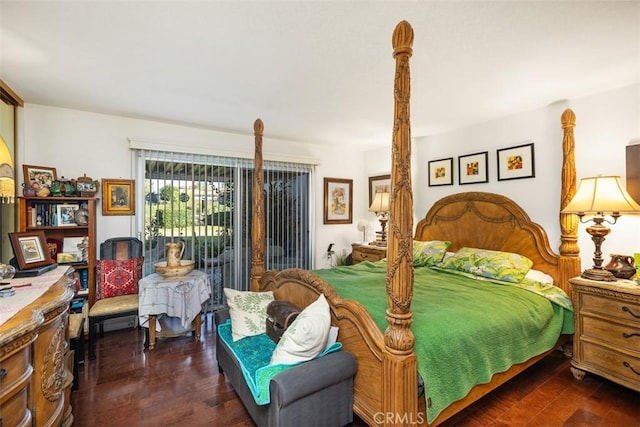 bedroom with access to exterior and dark hardwood / wood-style flooring