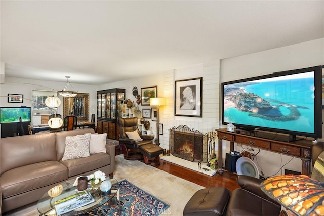 living room featuring hardwood / wood-style flooring and a fireplace