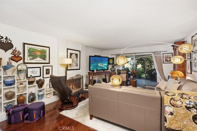 living room with a fireplace and hardwood / wood-style floors