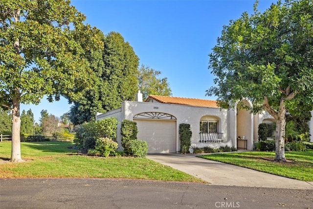 view of front facade with a garage and a front yard