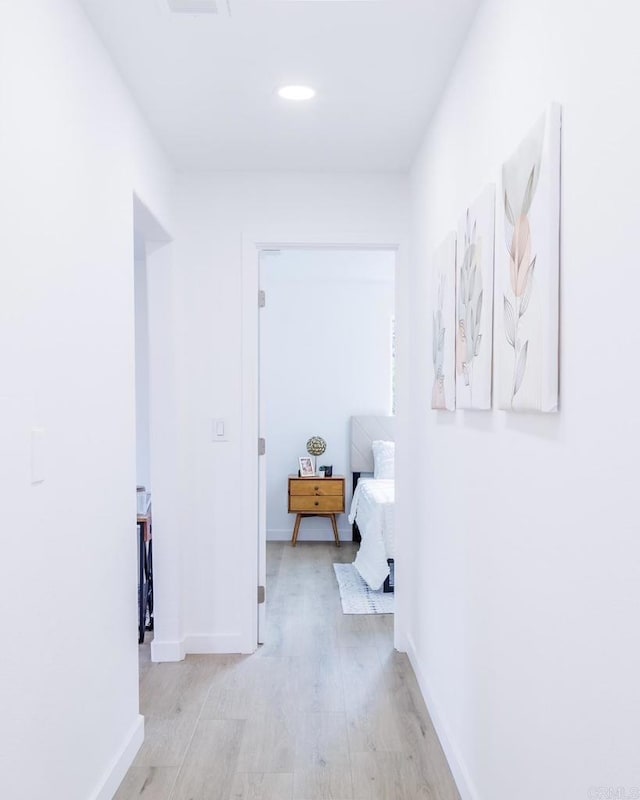 corridor featuring light hardwood / wood-style flooring