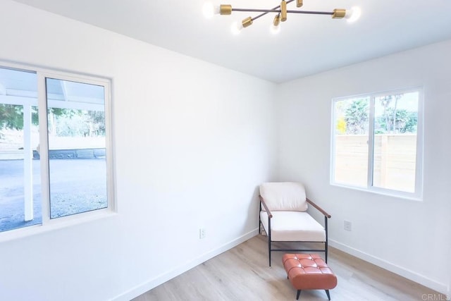 sitting room featuring light hardwood / wood-style flooring