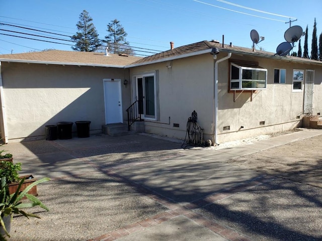 rear view of house featuring a patio area