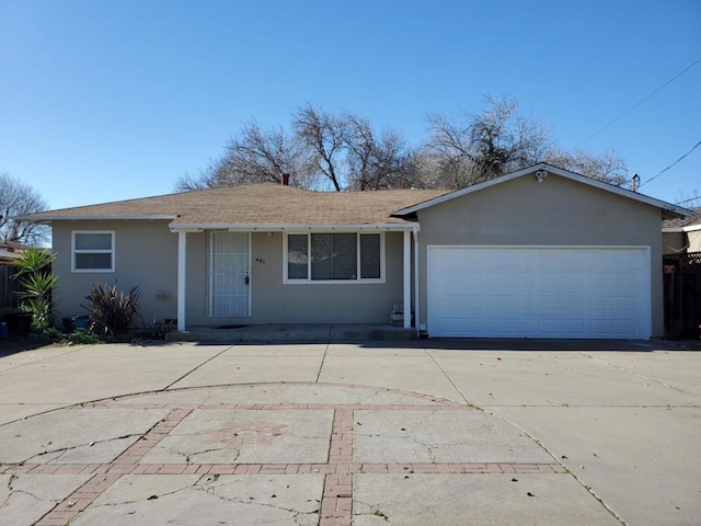 single story home featuring a garage