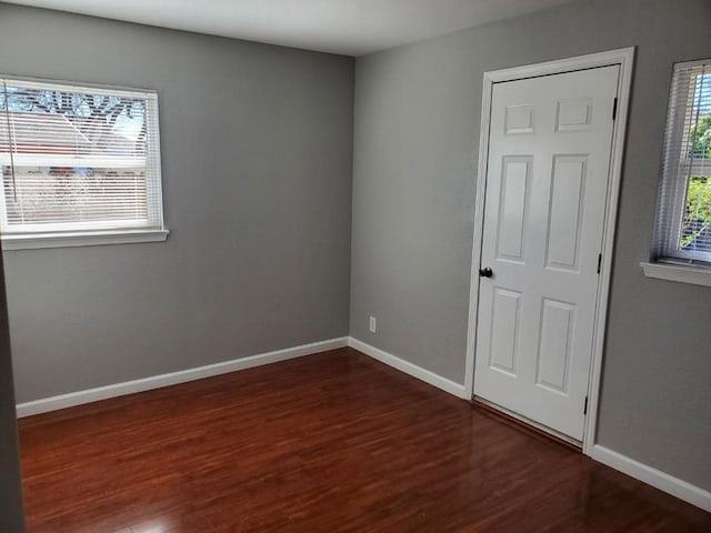 empty room featuring dark hardwood / wood-style floors