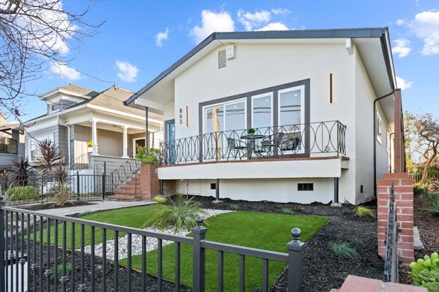 view of front of home with a front yard