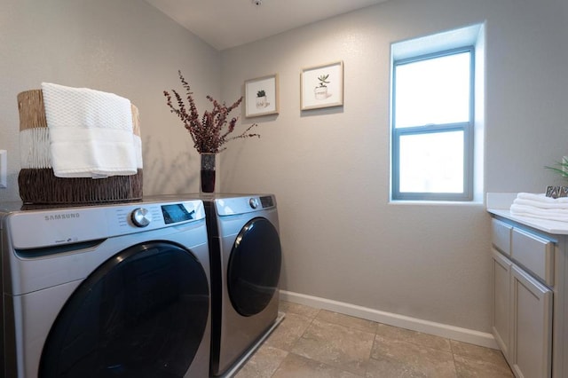 laundry room with cabinets and independent washer and dryer