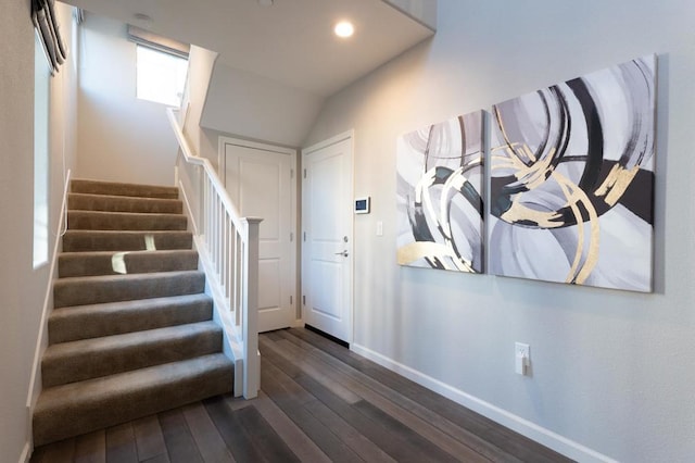 entryway with dark hardwood / wood-style flooring